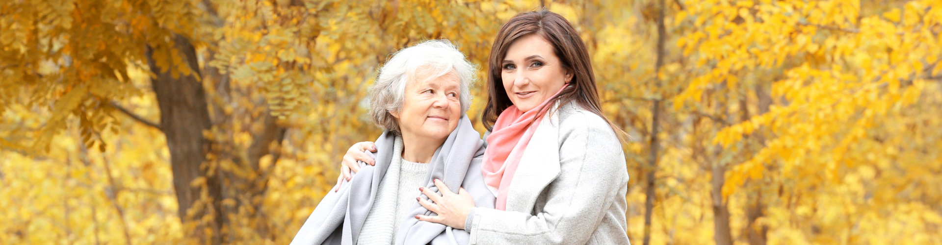 senior woman looking at her caregiver