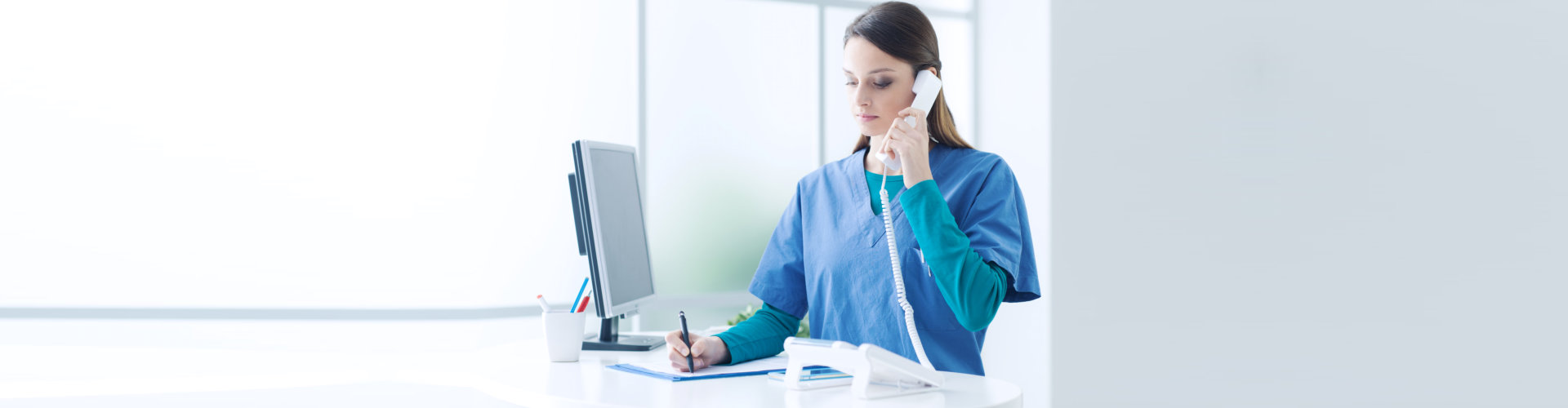 caregiver holding a telephone